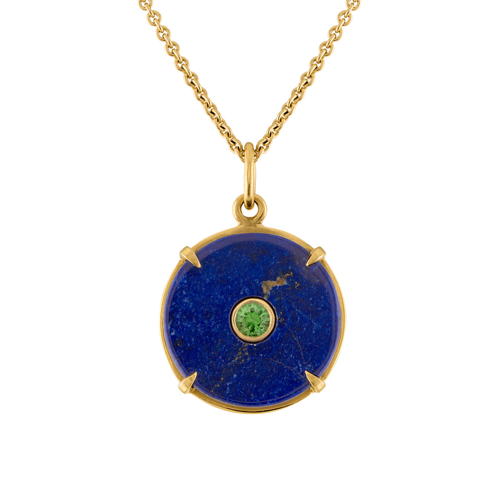 Lapis circle pendant set in 18k gold with green tsavorite center stone